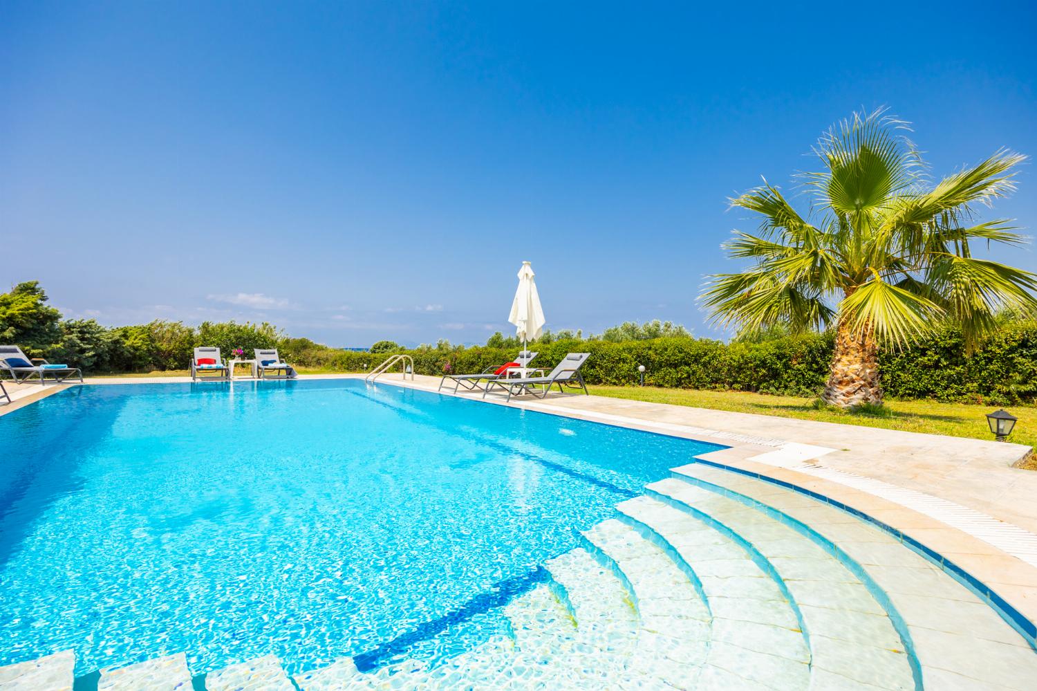 Private pool, terrace, and garden with sea views