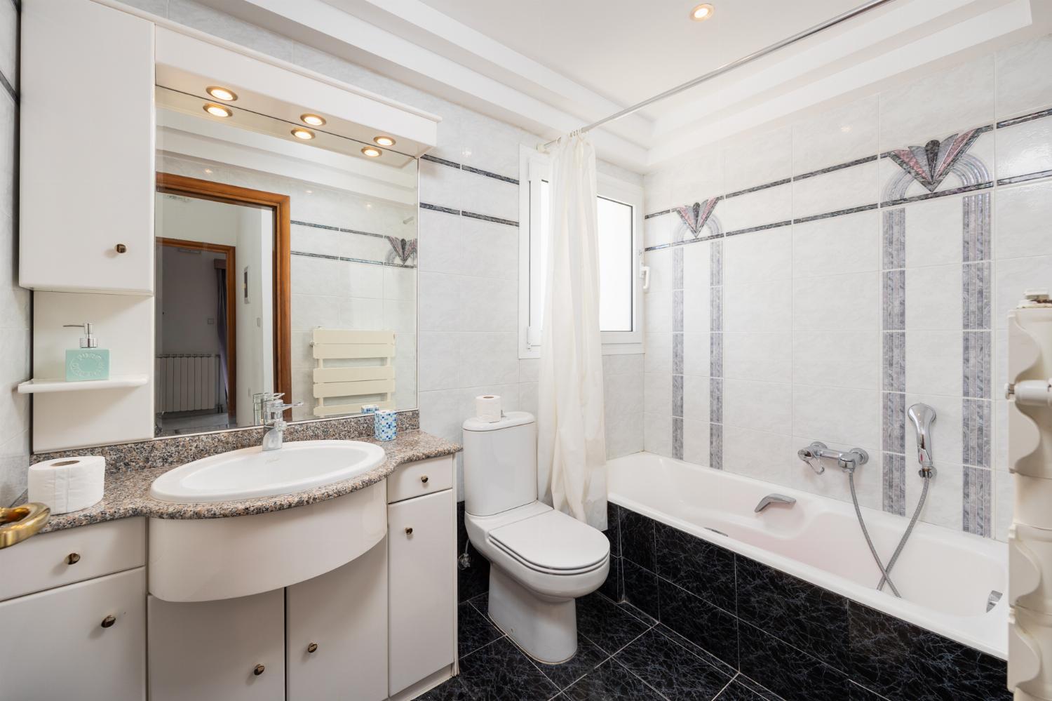 Family bathroom with bath and shower