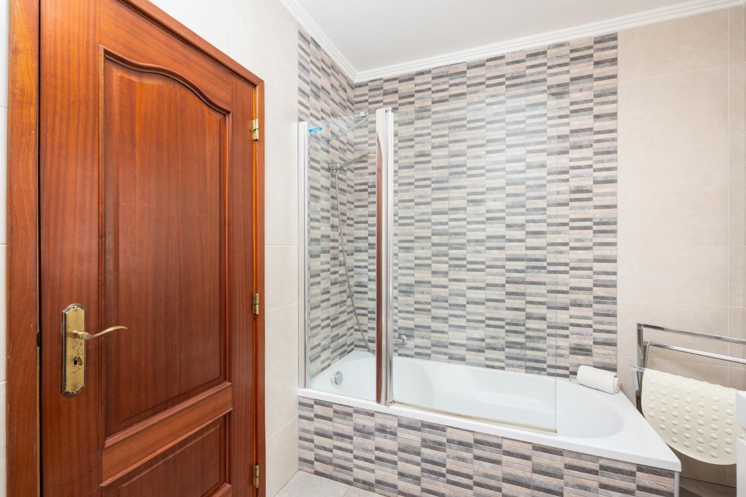 Family bathroom with bath and shower