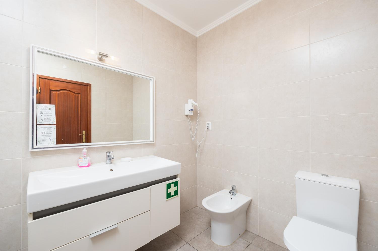 Family bathroom with bath and shower