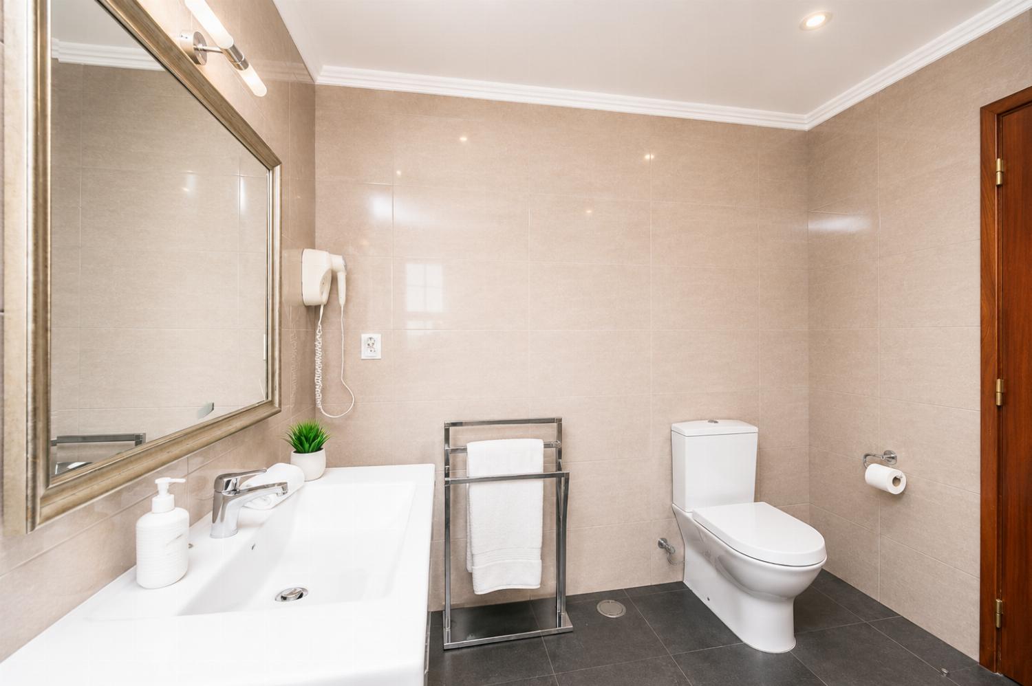 Family bathroom with bath and shower