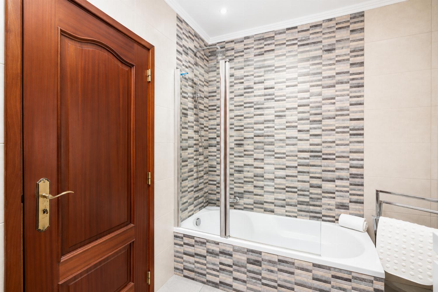 Family bathroom with bath and shower