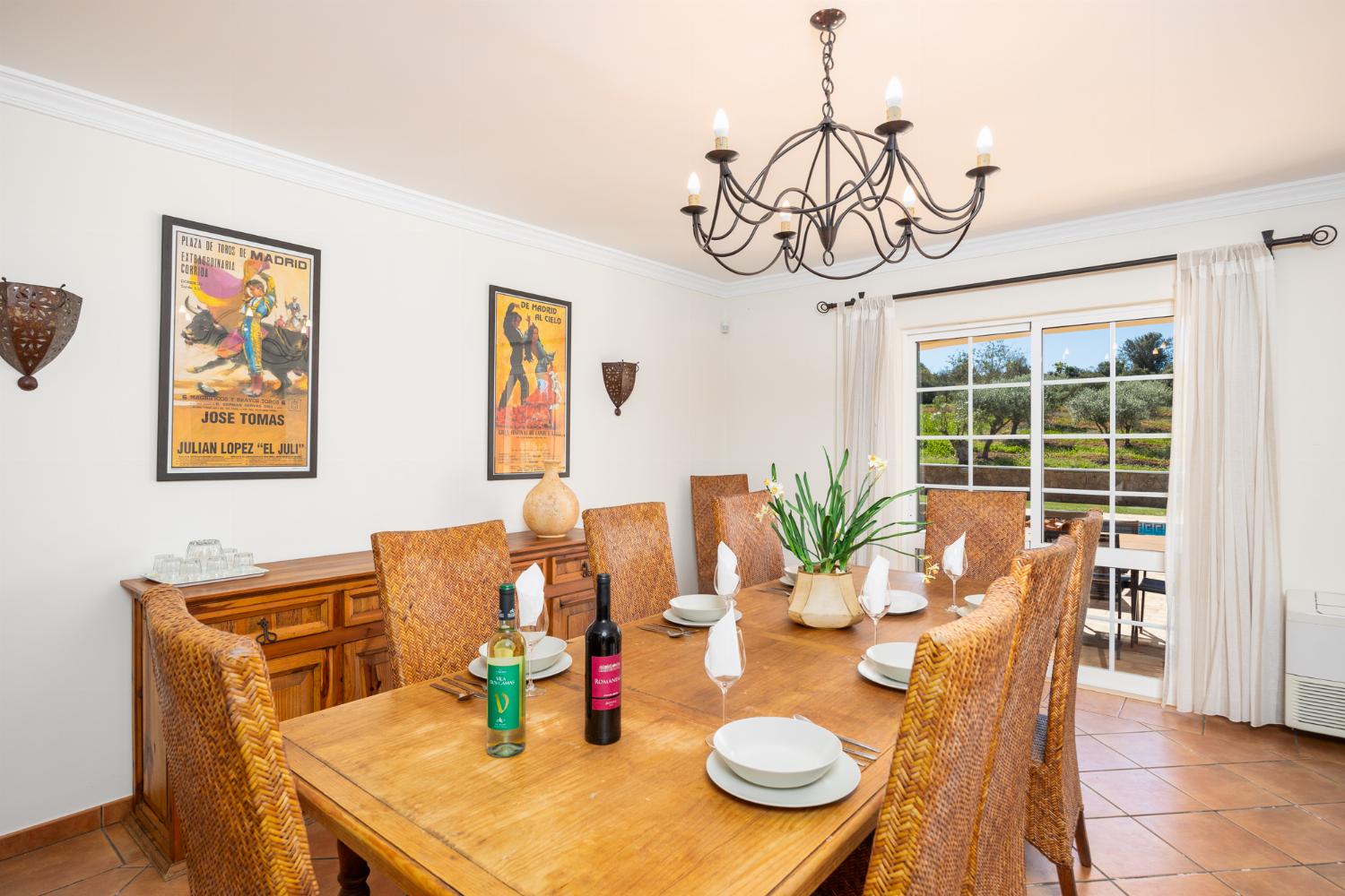 Living room with sofas, dining area, ornamental fireplace, WiFi internet, and satellite TV