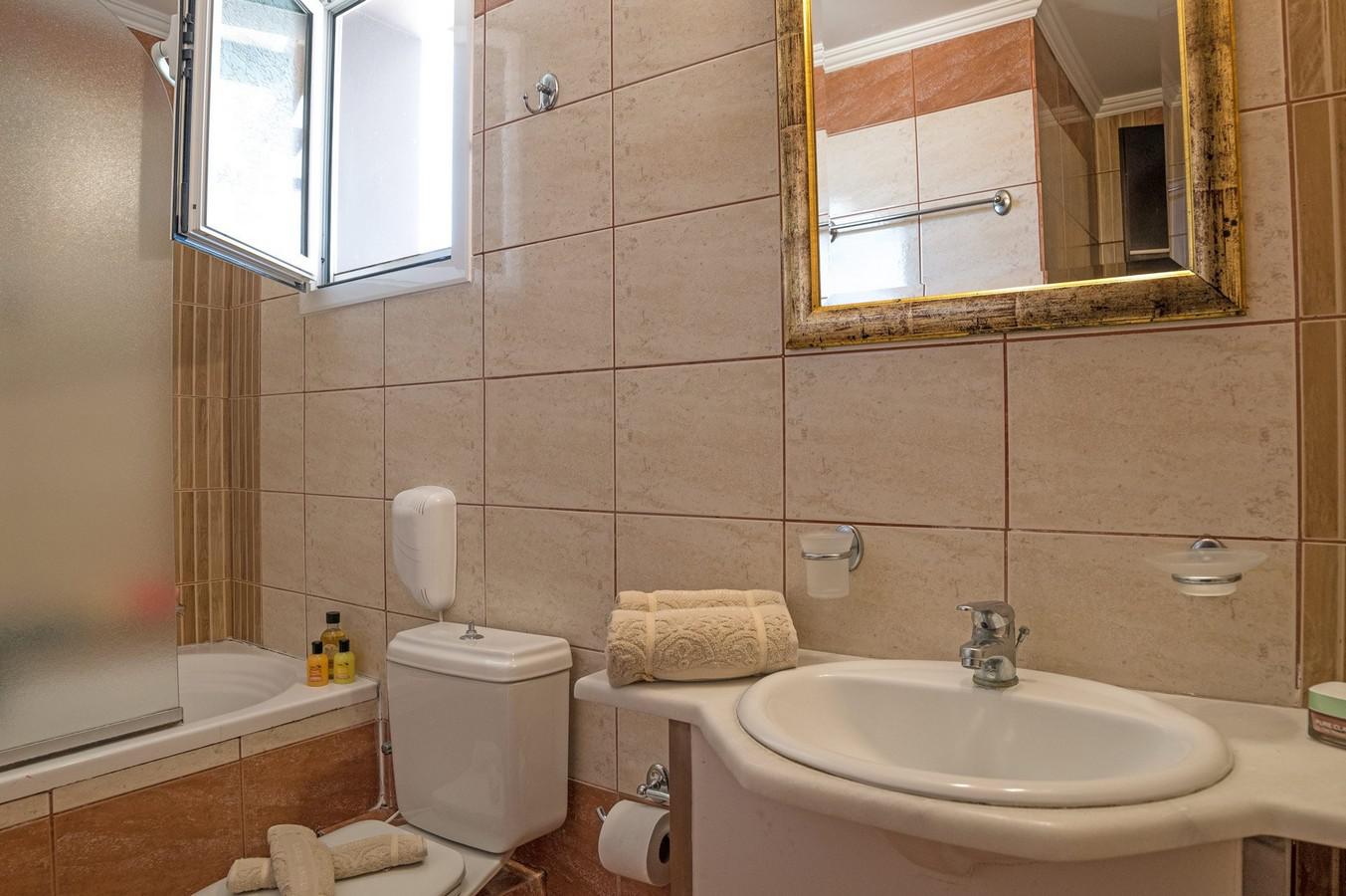 En suite bathroom with bath