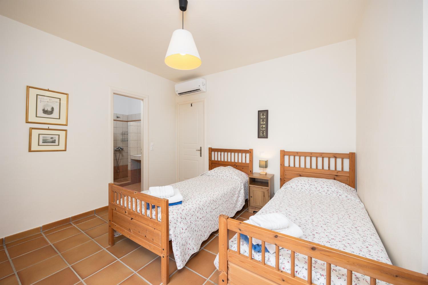 Twin bedroom with en suite bathroom and A/C