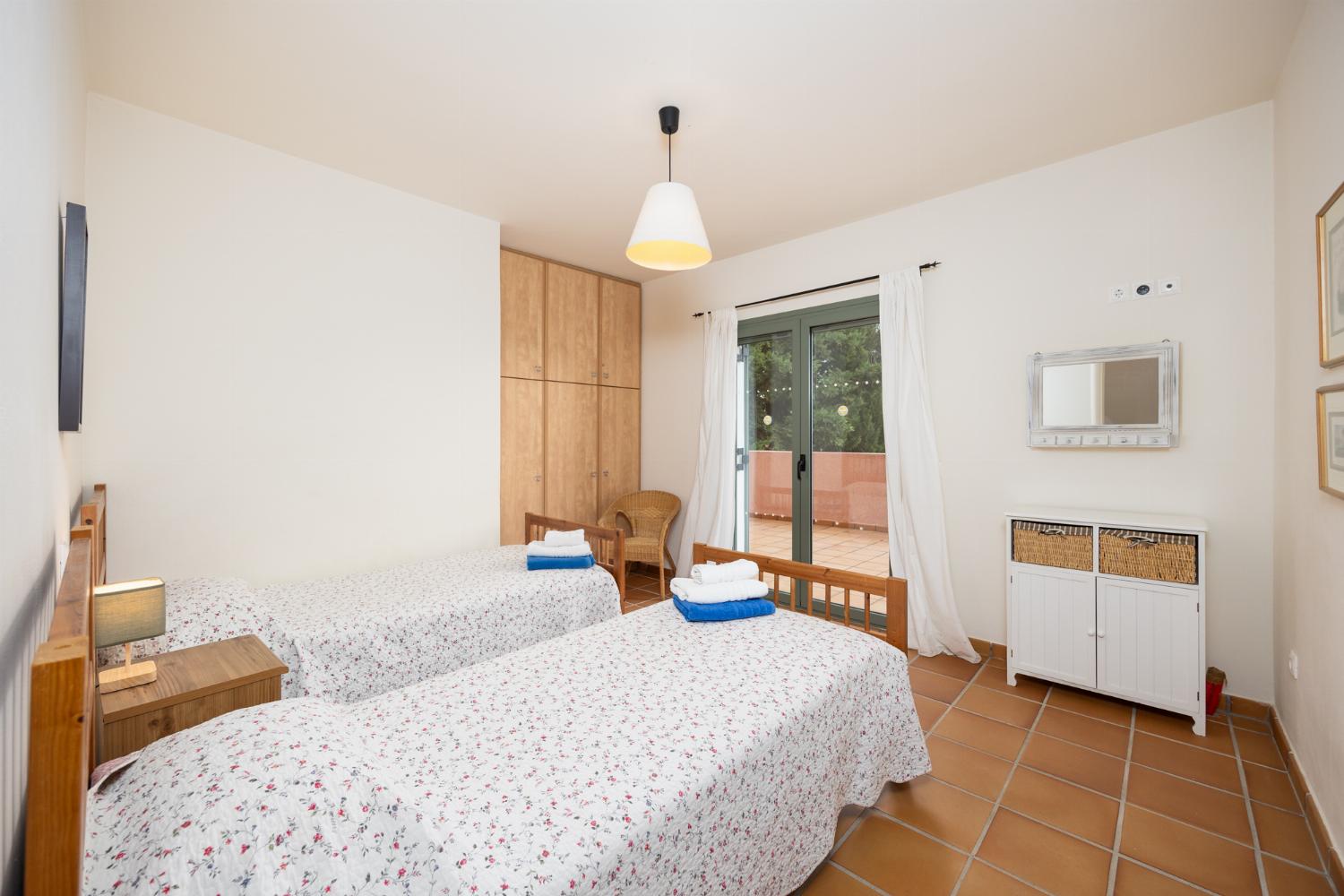 Twin bedroom with en suite bathroom and A/C