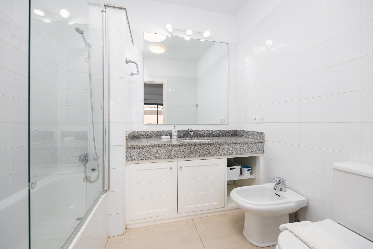 Family bathroom with bath and shower