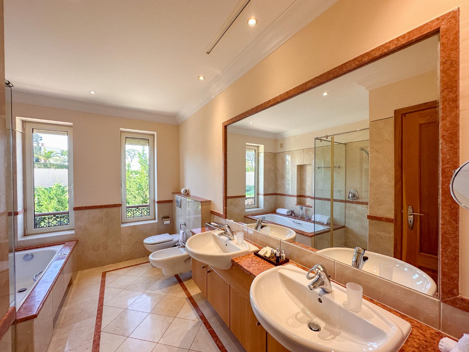En suite bathroom with bath