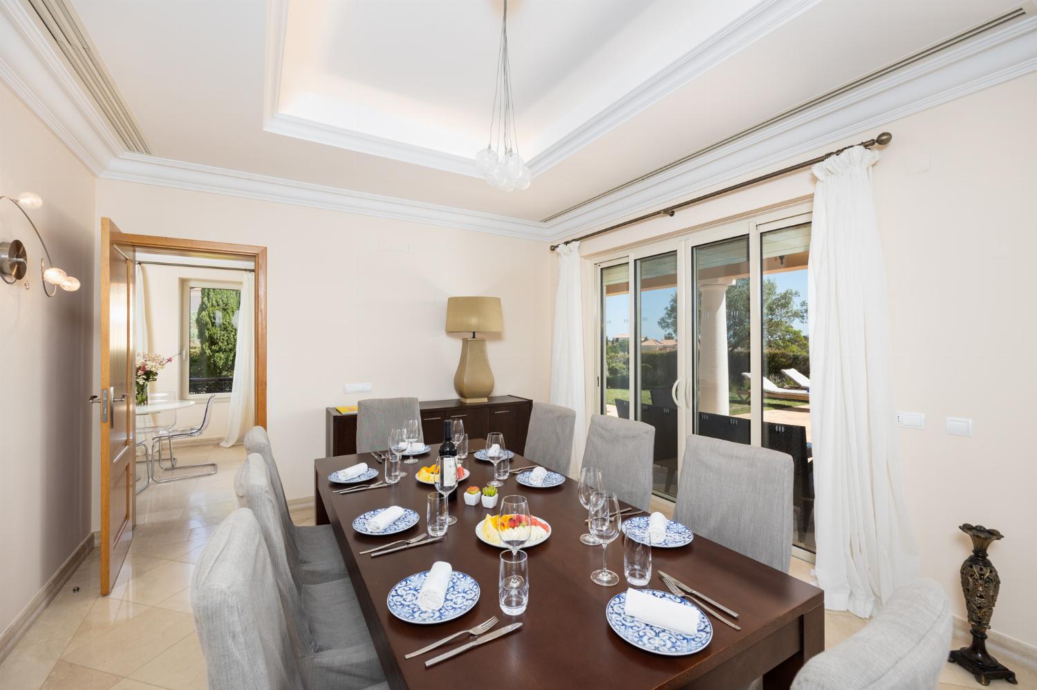 Living room with sofas, dining area, ornamental fireplace, A/C, WiFi internet, and satellite TV