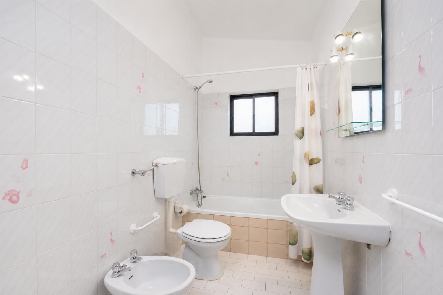 Family bathroom with bath and shower