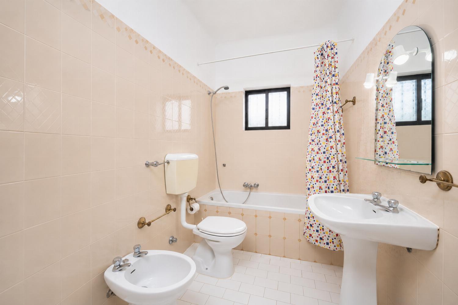 Family bathroom with bath and shower