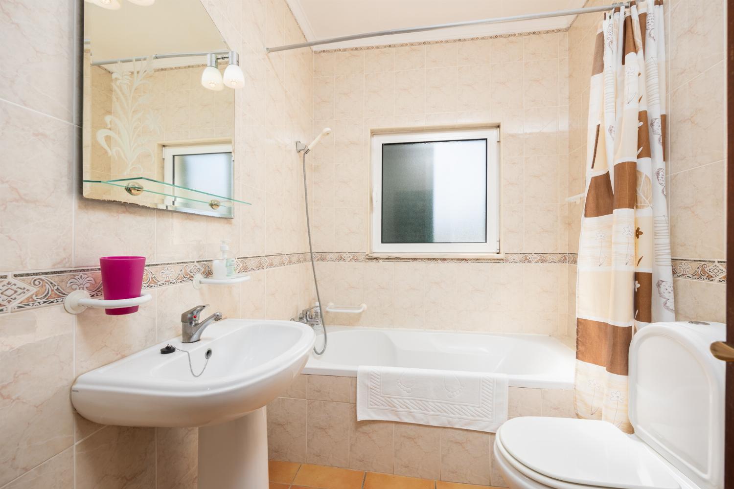 Family bathroom with bath and shower
