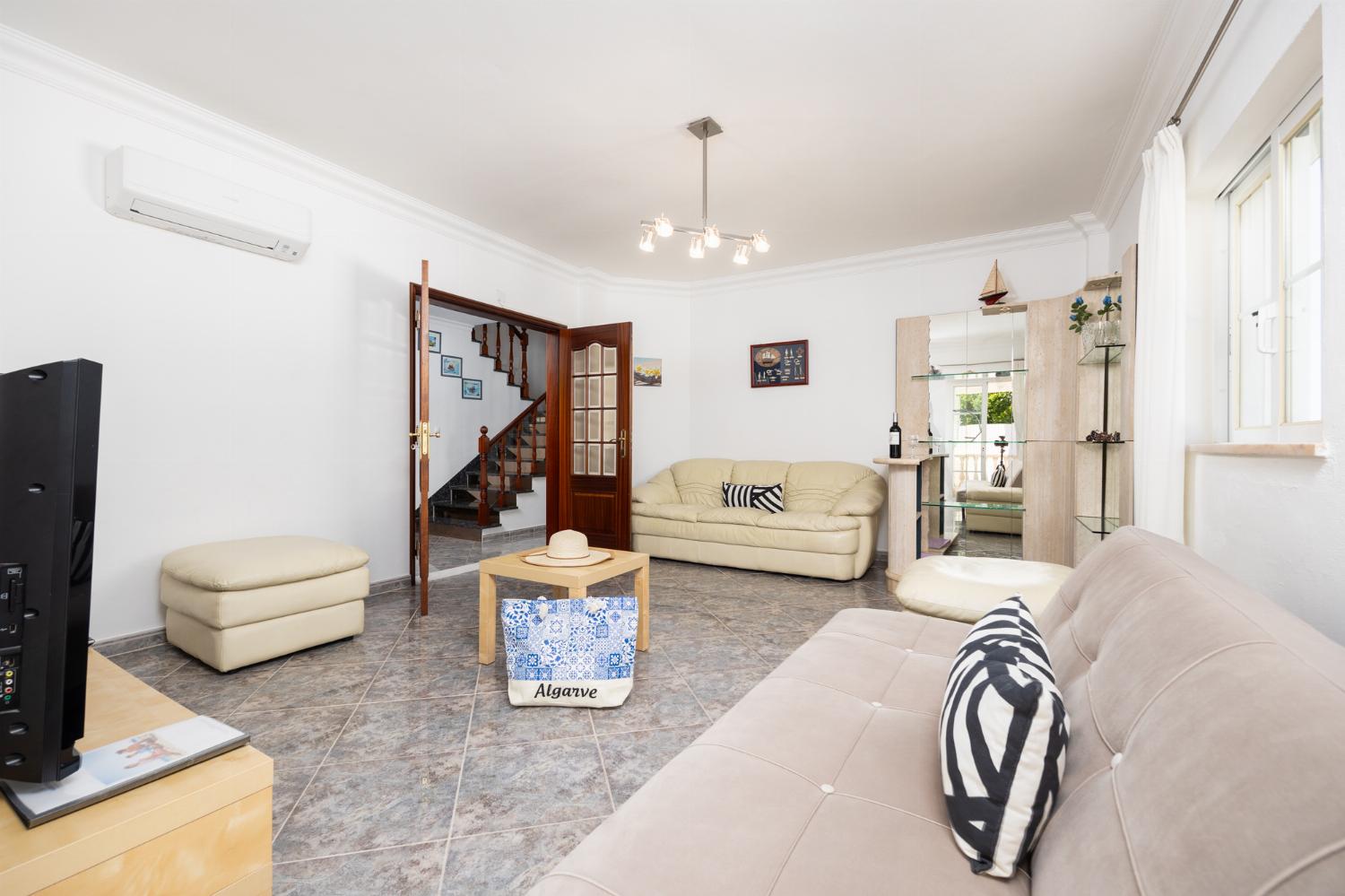 Living room with sofas, A/C, WiFi internet, and satellite TV