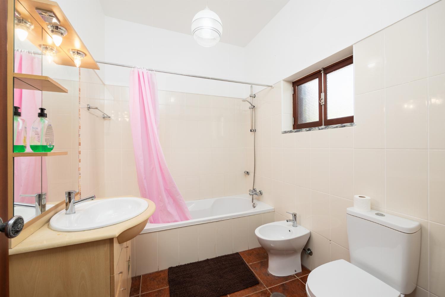 Family bathroom with bath and shower