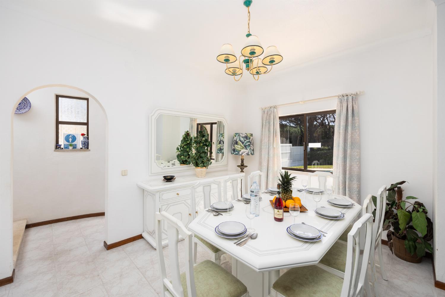 Living room with sofas, dining area, ornamental fireplace, WiFi internet, and satellite TV