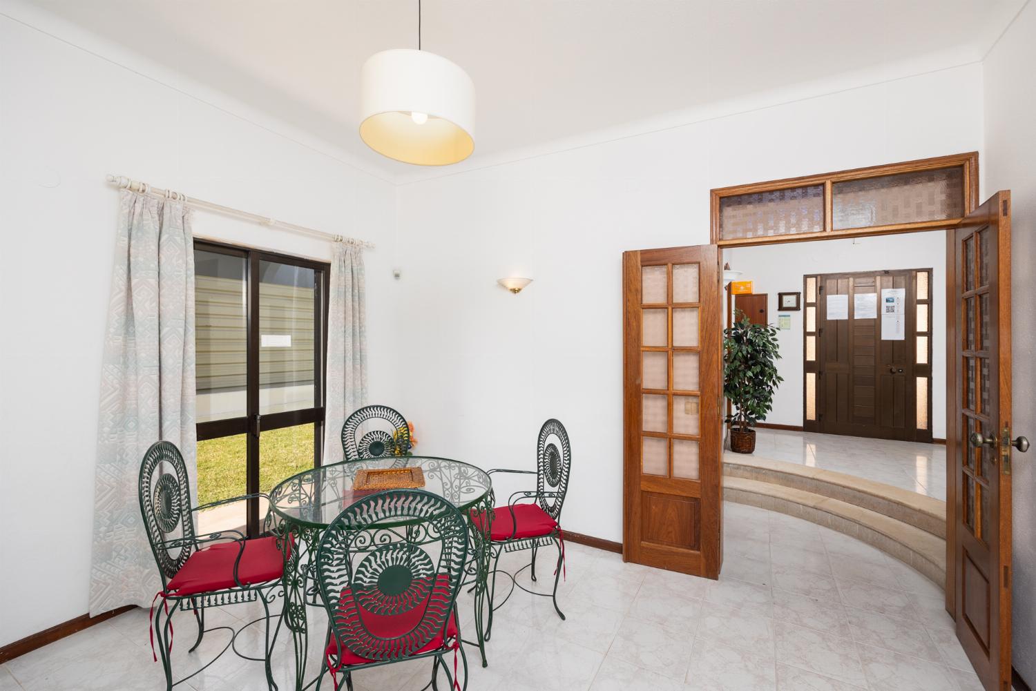 Living room with sofas, dining area, ornamental fireplace, WiFi internet, and satellite TV