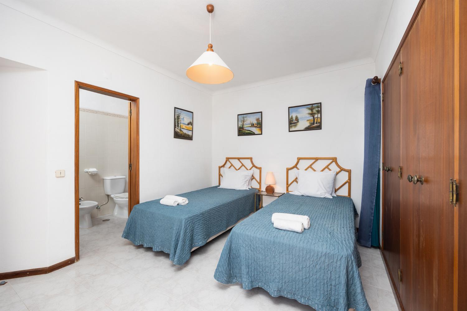 Twin bedroom with en suite bathroom and A/C