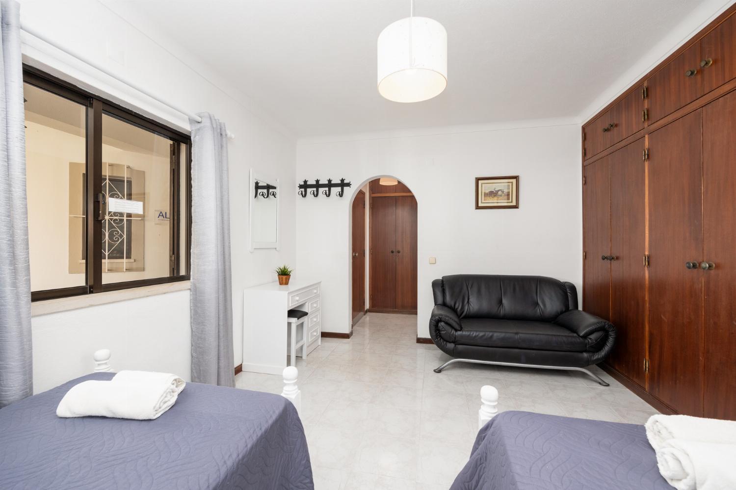Twin bedroom with en suite bathroom and A/C