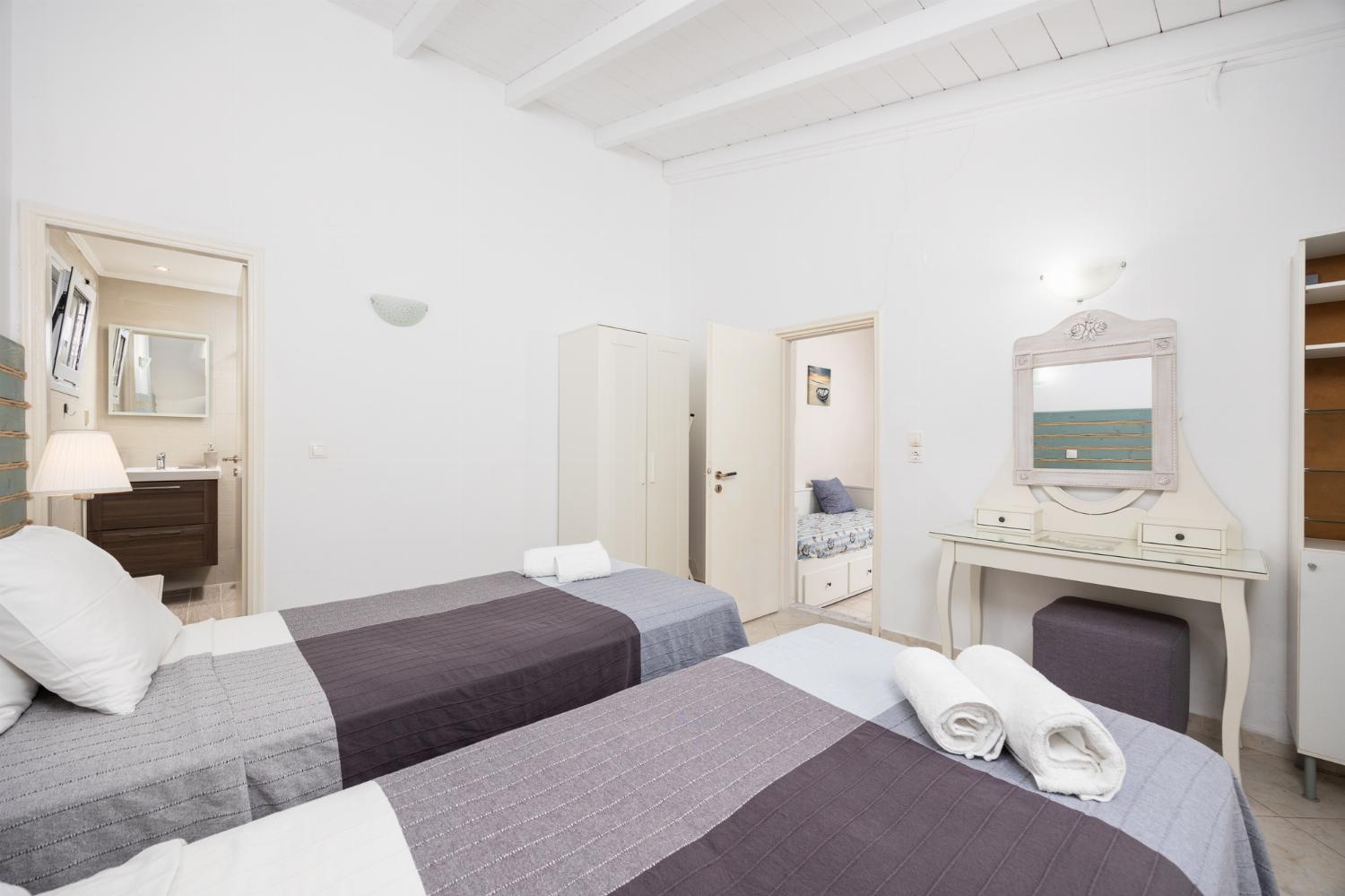 Twin bedroom with en suite bathroom and A/C