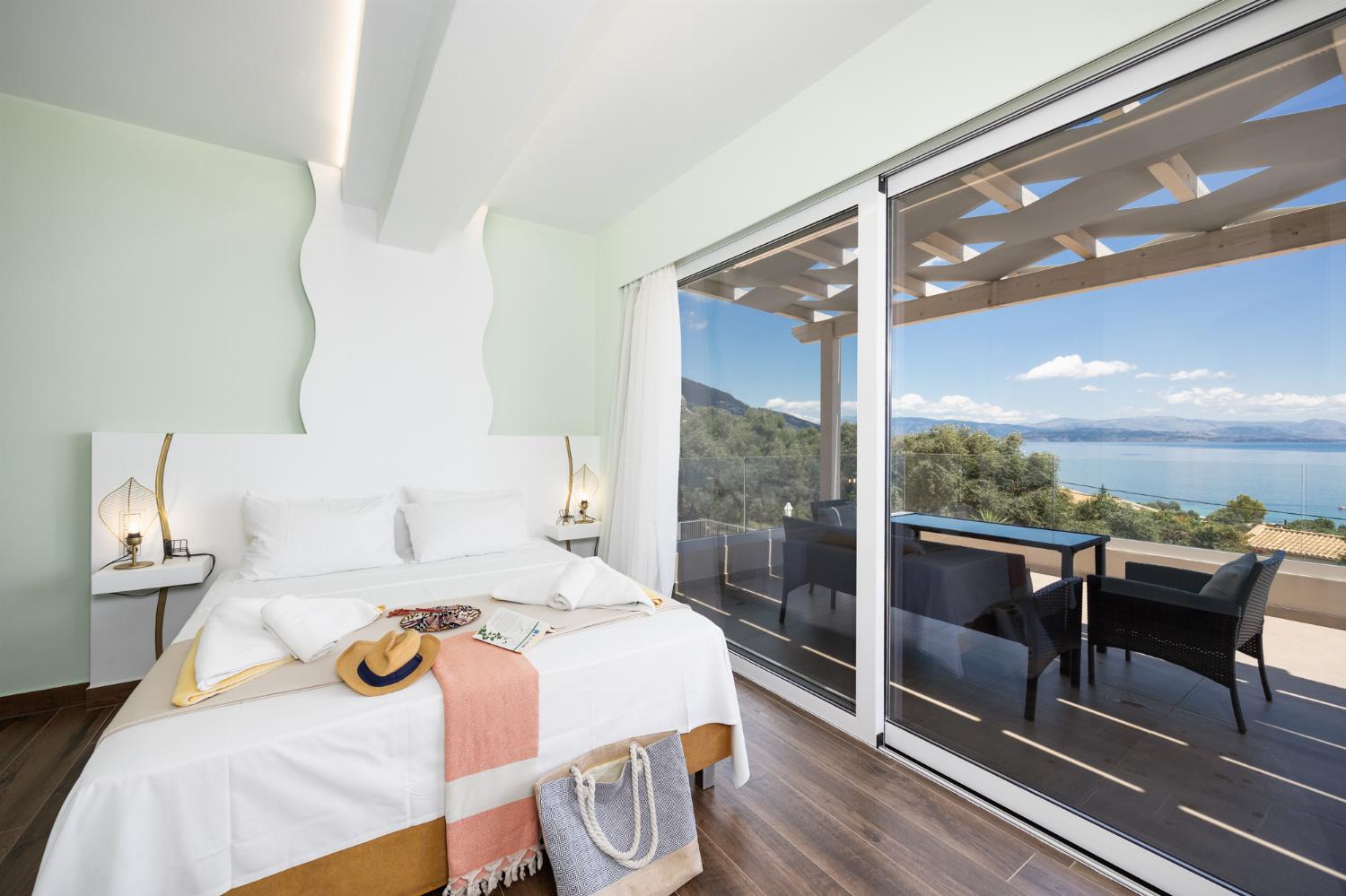 Double bedroom with en suite bathroom, A/C, and sea views