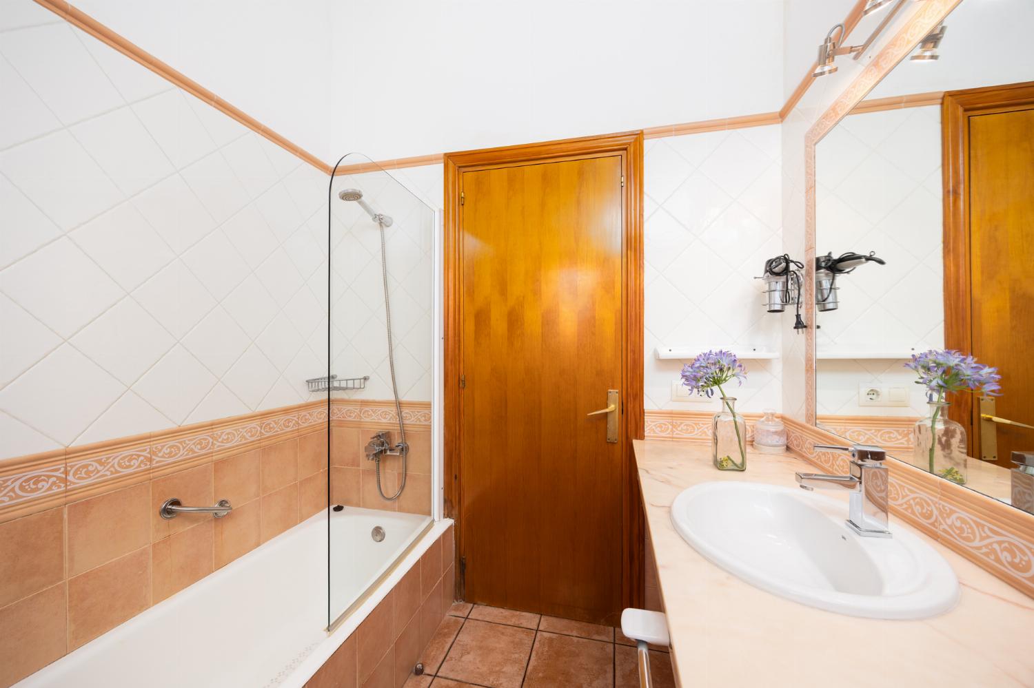 Family bathroom with bath and shower