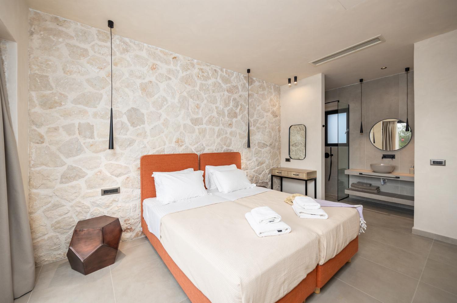 Twin bedroom with en suite bathroom and A/C