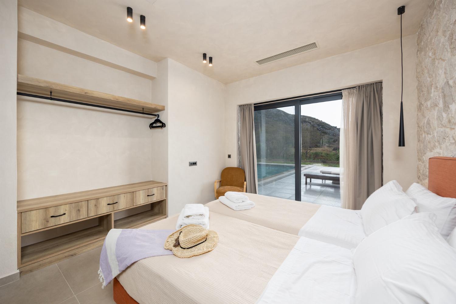 Twin bedroom with en suite bathroom and A/C
