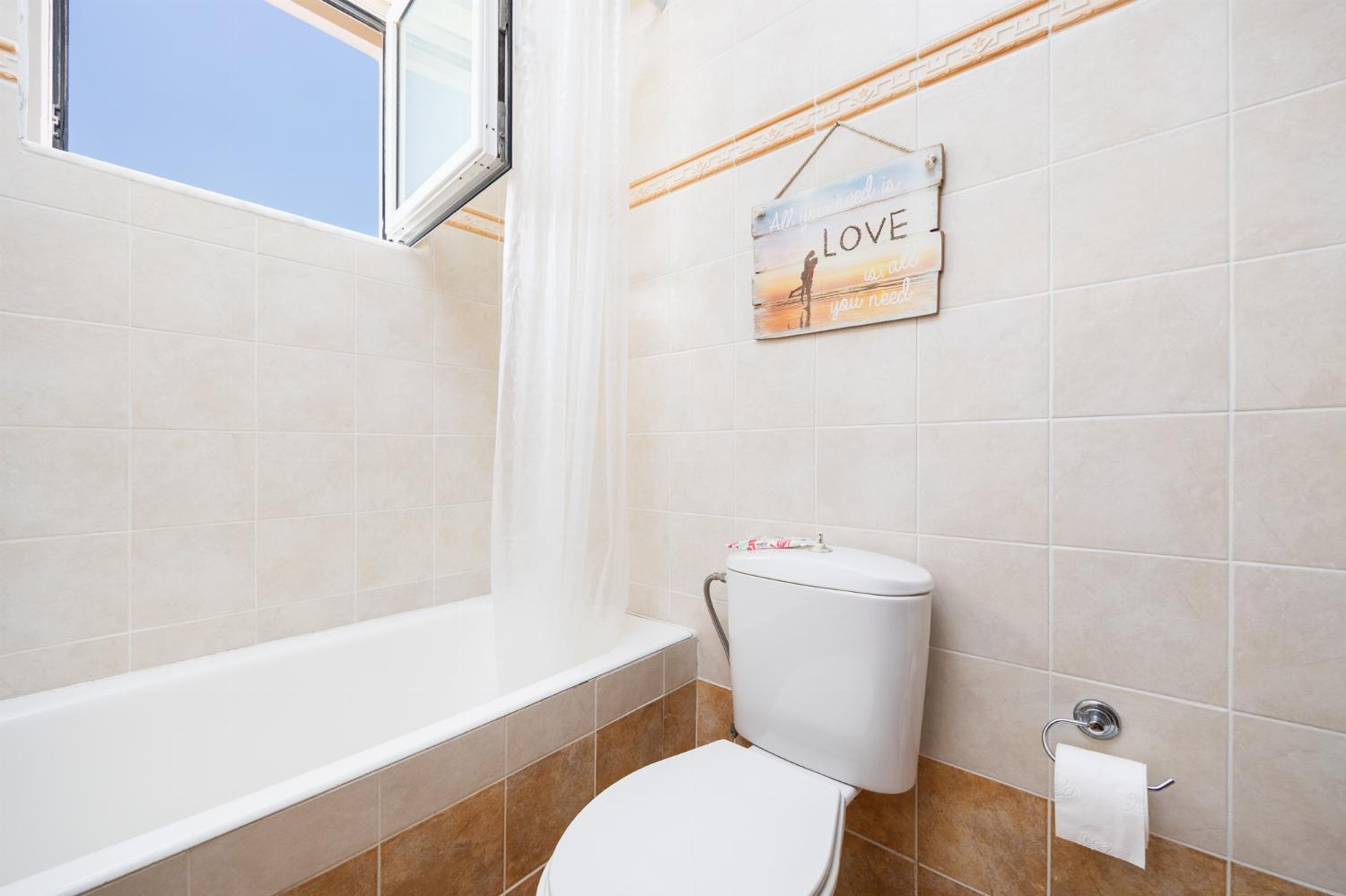 Family bathroom with bath and shower