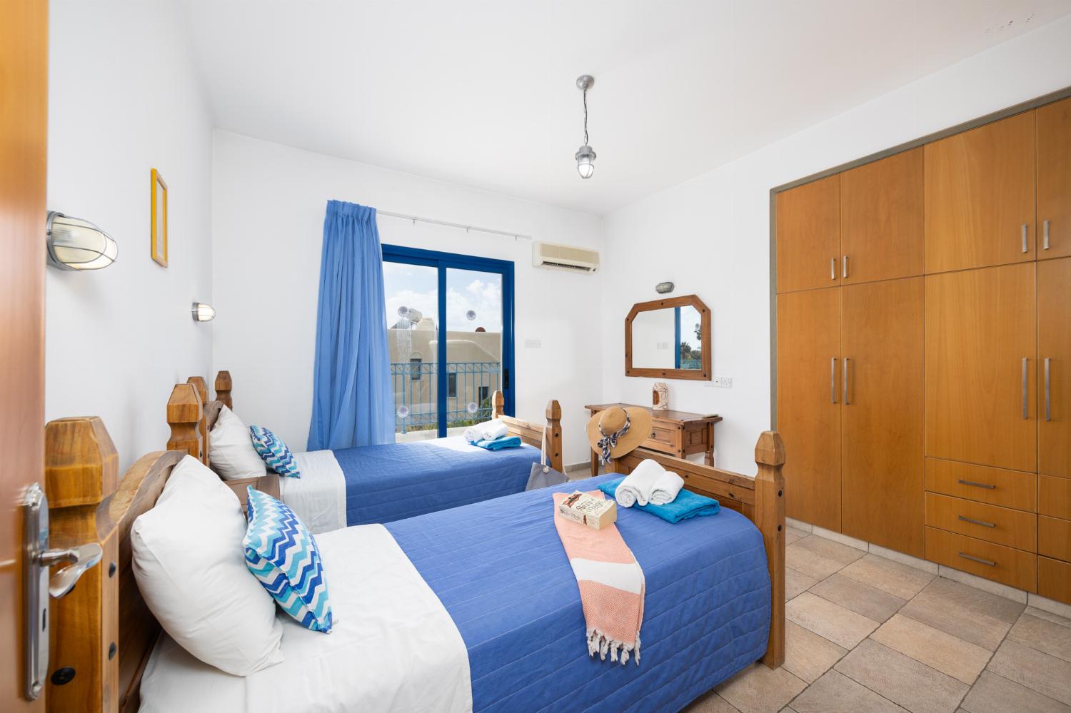 Twin bedroom with en suite bathroom and A/C