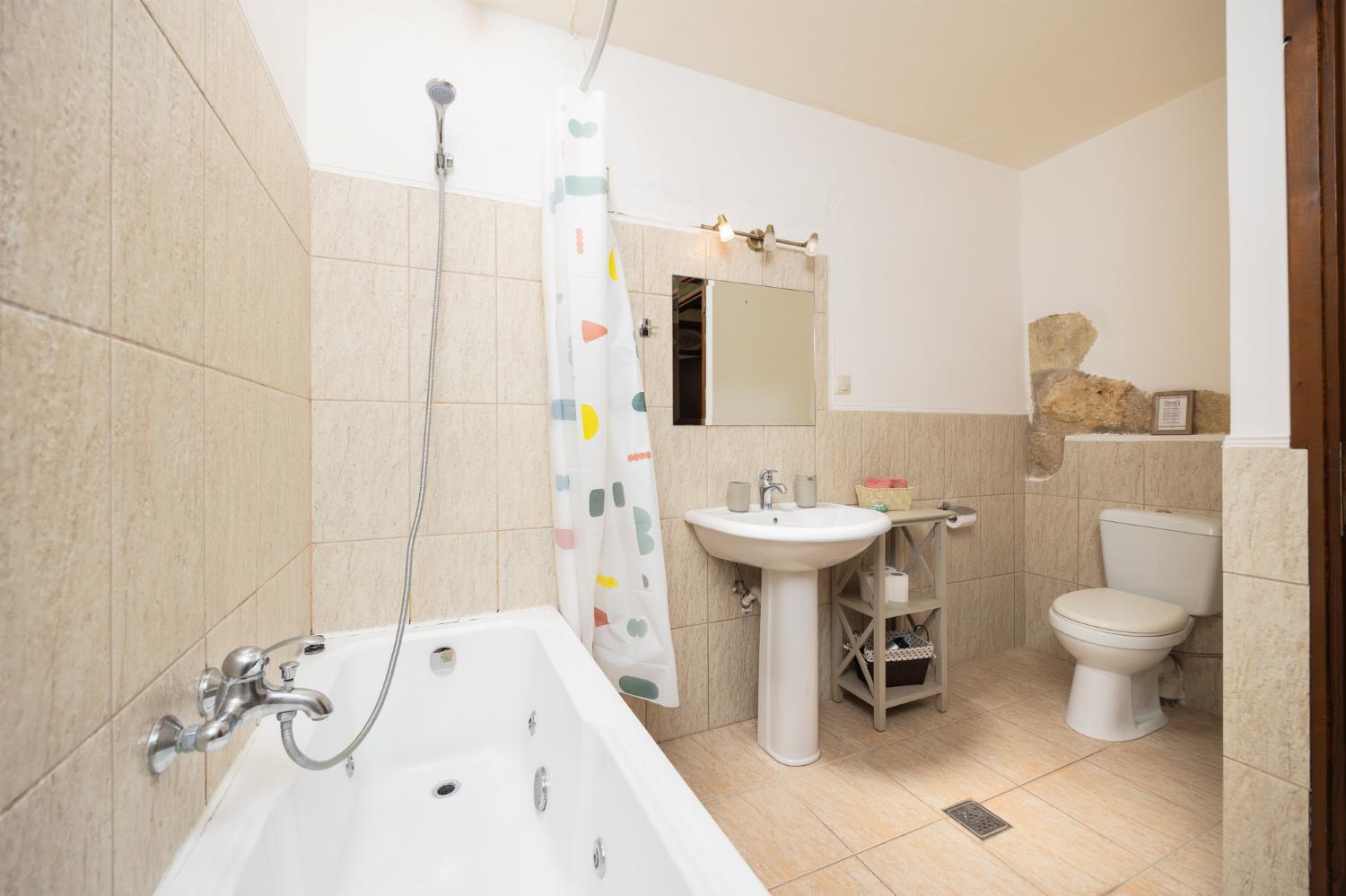 Family bathroom with bath and shower