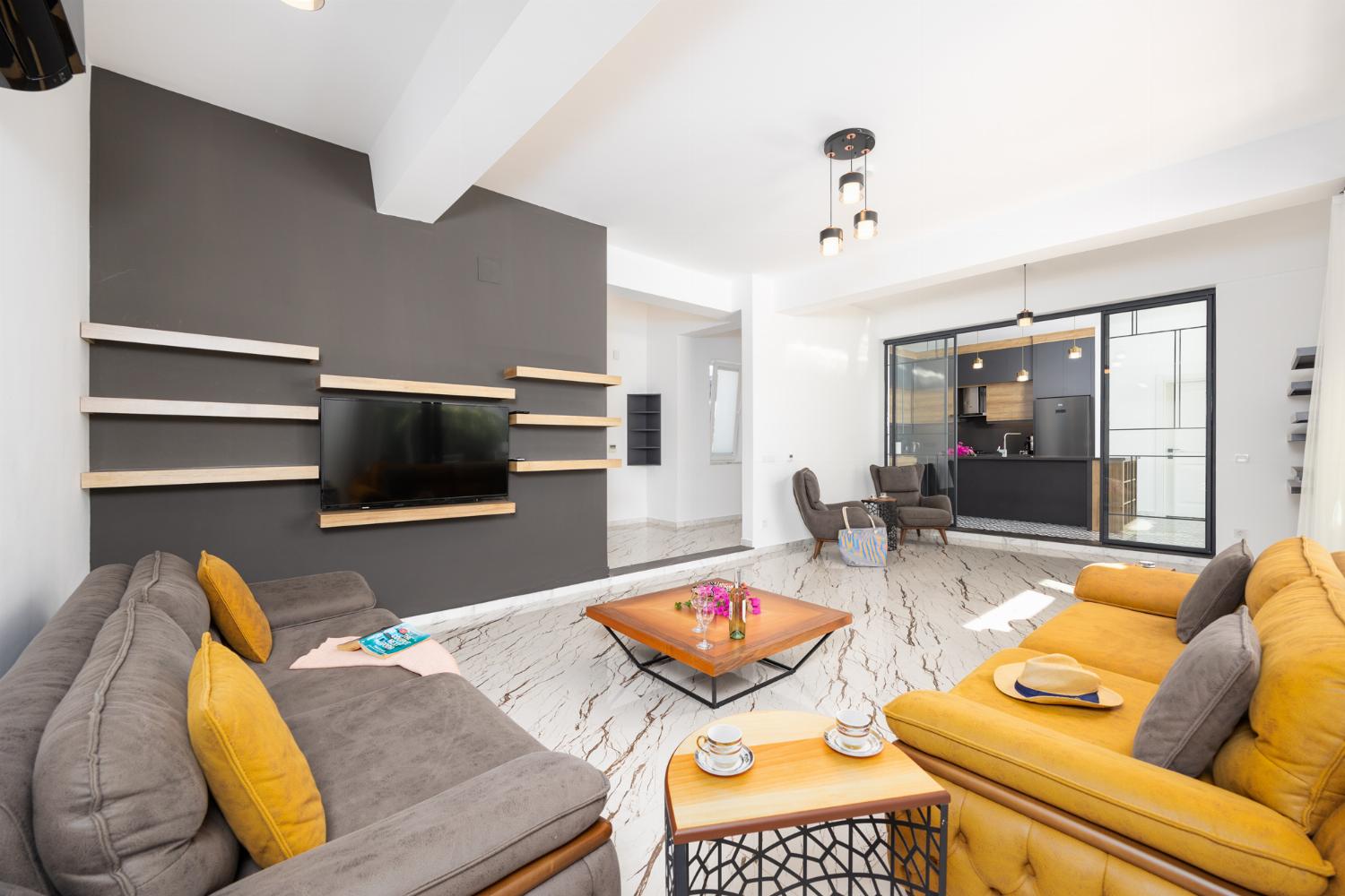 Living room with sofas, A/C, WiFi internet, and satellite TV