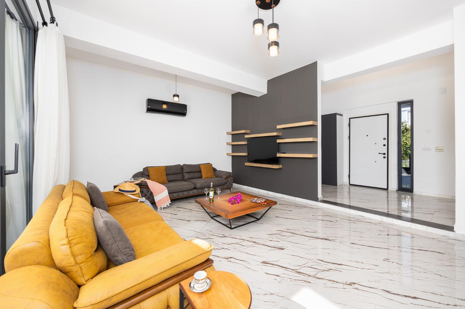 Living room with sofas, A/C, WiFi internet, and satellite TV