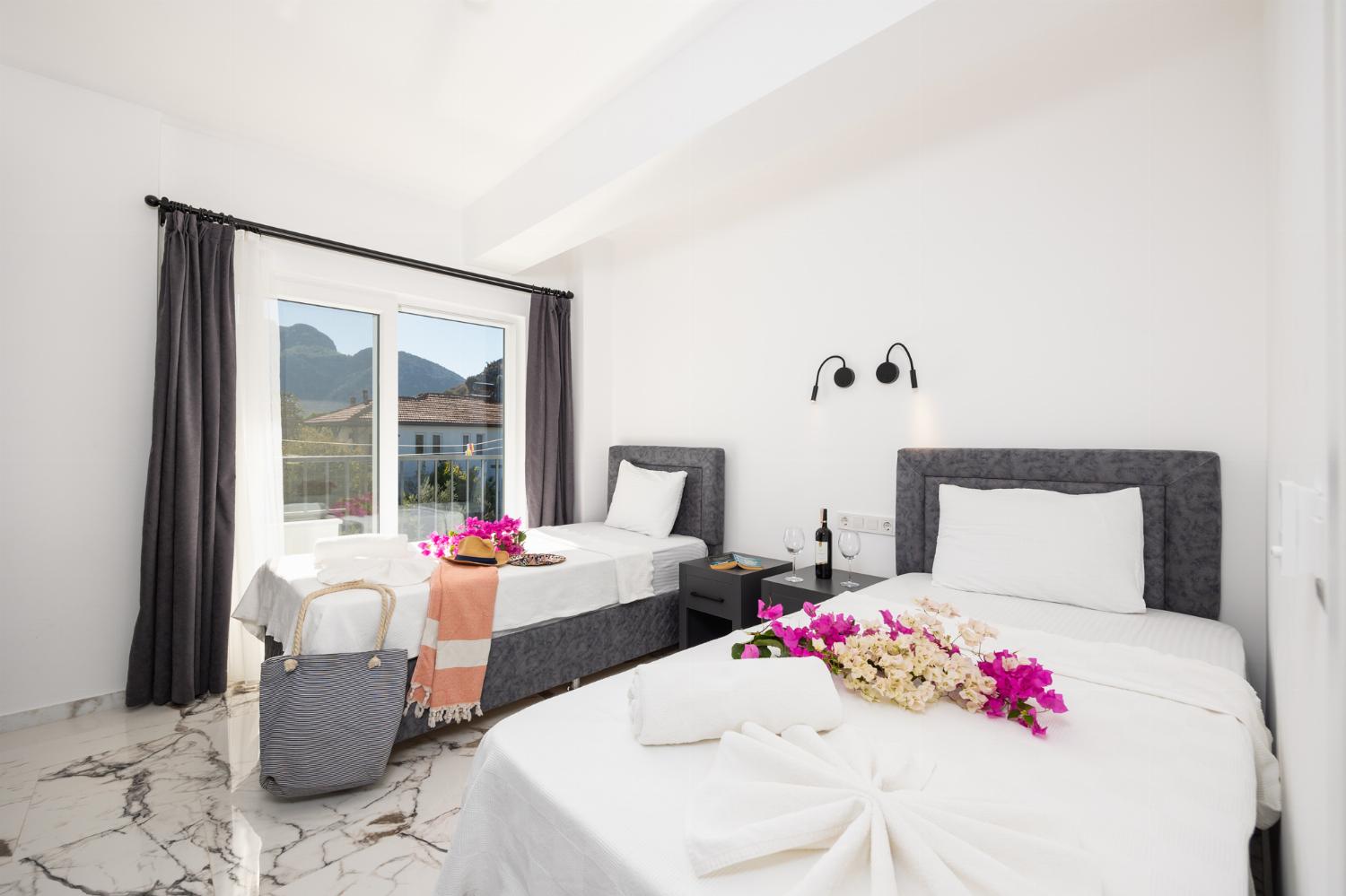 Twin bedroom with en suite bathroom and A/C