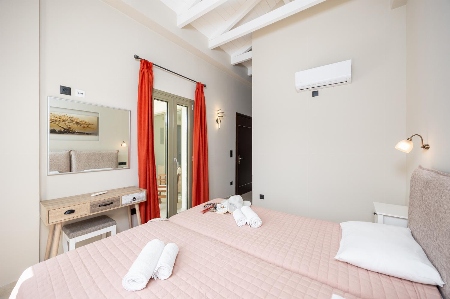 Twin bedroom with en suite bathroom and A/C