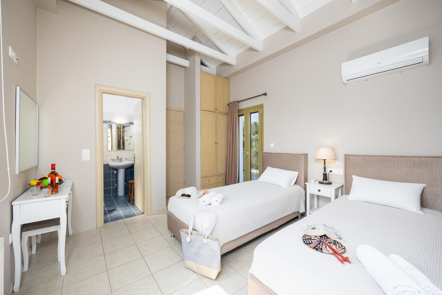 Twin bedroom with en suite bathroom and A/C