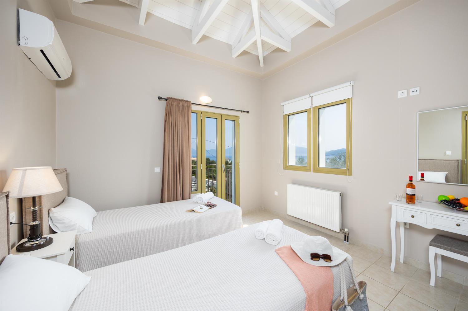 Twin bedroom with en suite bathroom and A/C