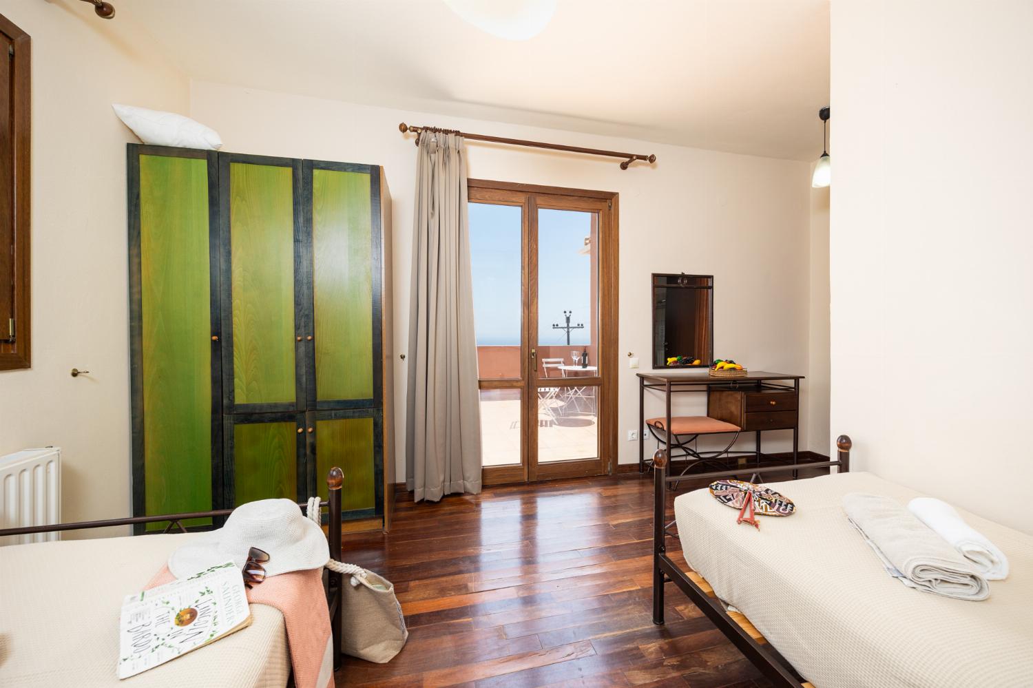 Twin bedroom with en suite bathroom and A/C