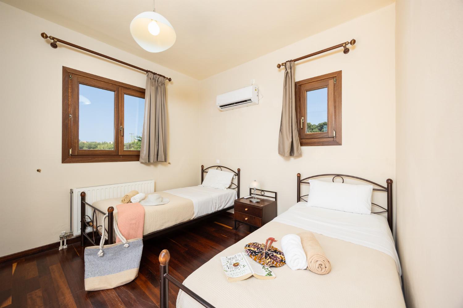 Twin bedroom with en suite bathroom and A/C