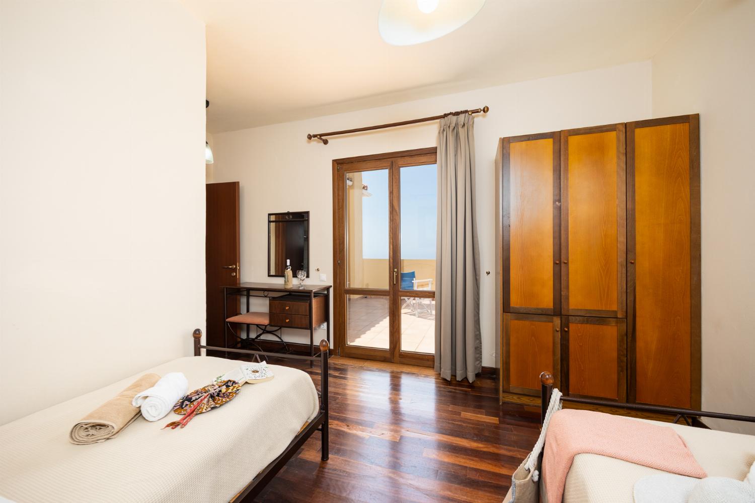Twin bedroom with en suite bathroom and A/C