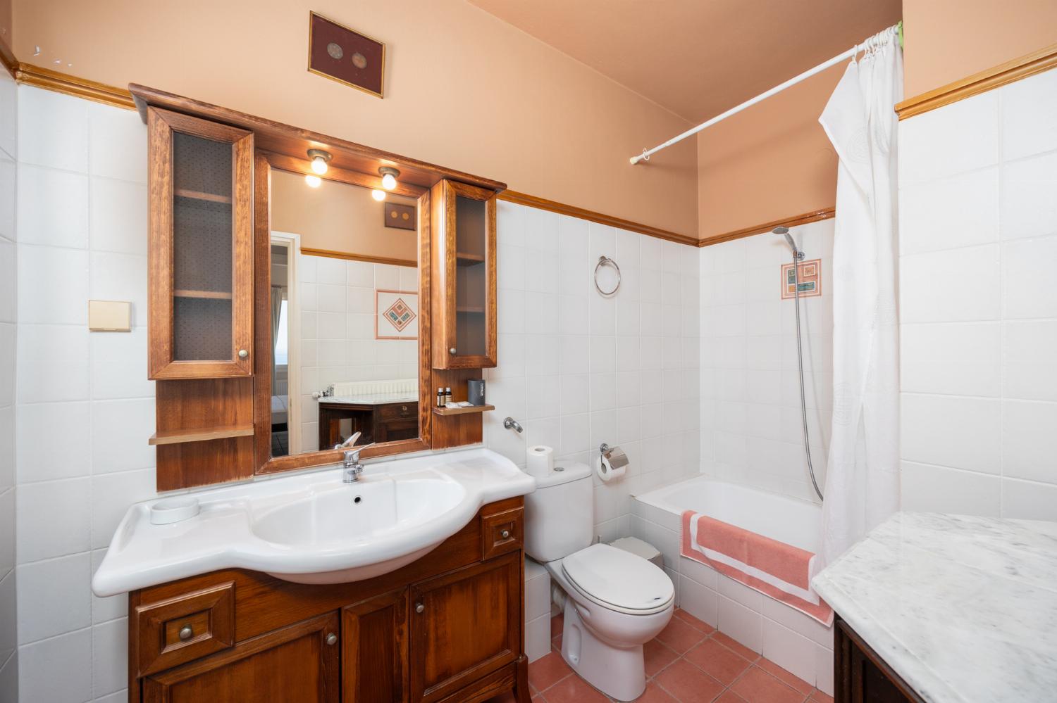 Family bathroom with bath and shower