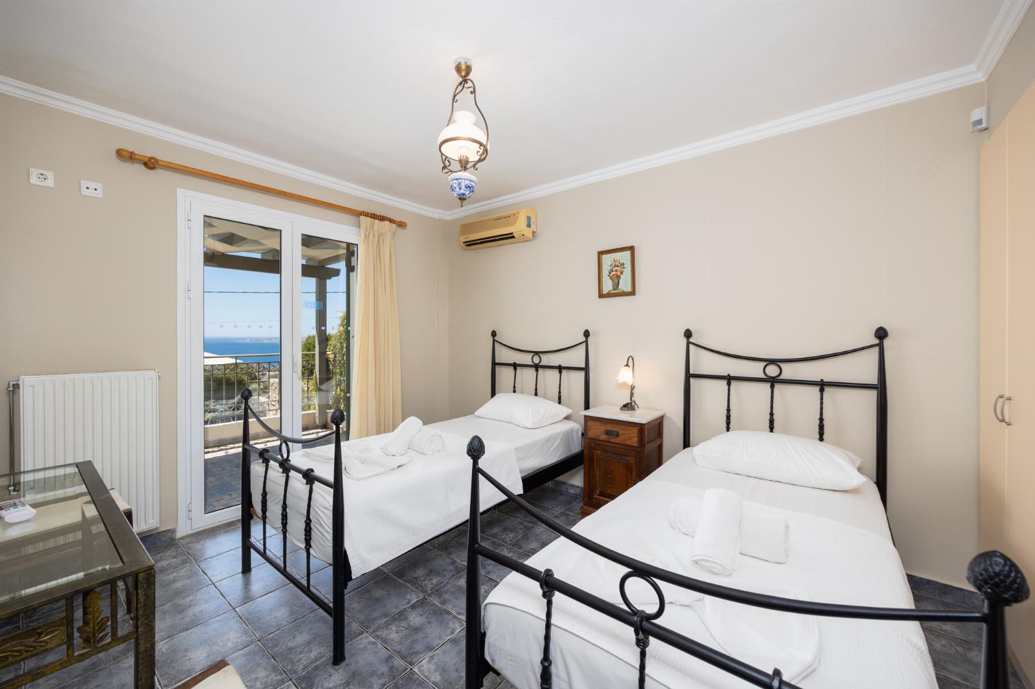 Twin bedroom with A/C and sea views