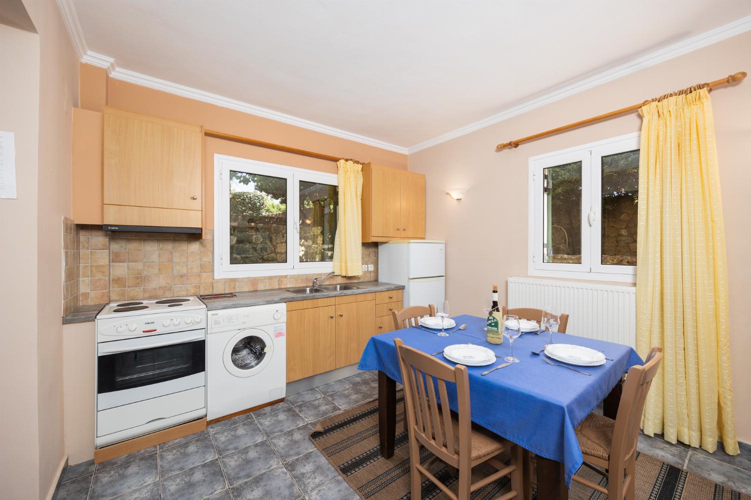 Downstairs apartment: equipped kitchen with dining area