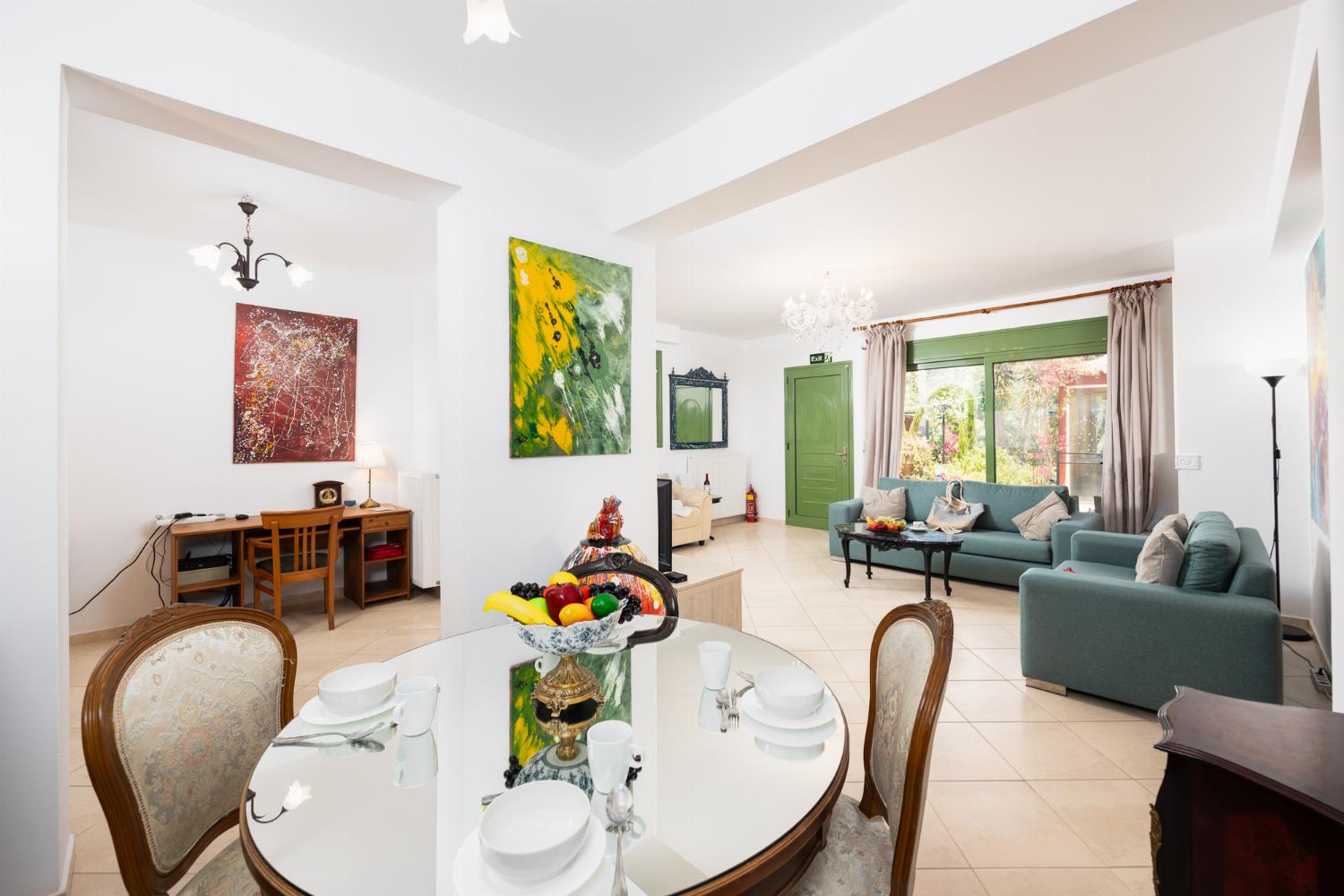 Living room with sofas, dining area, A/C, WiFi internet, and satellite TV