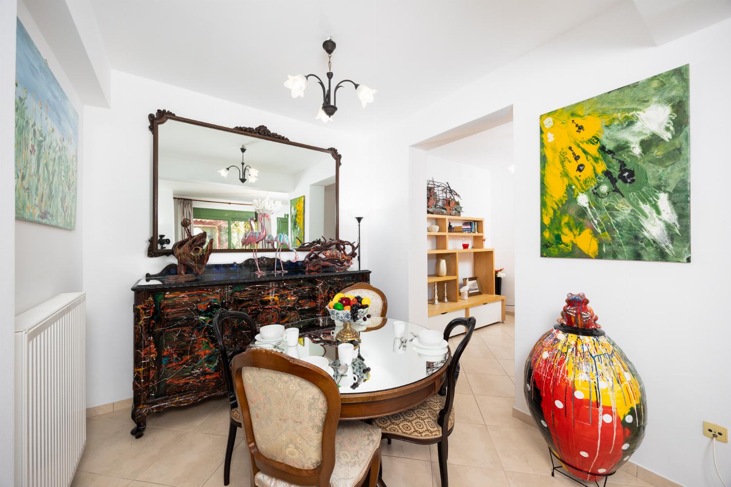 Living room with sofas, dining area, A/C, WiFi internet, and satellite TV