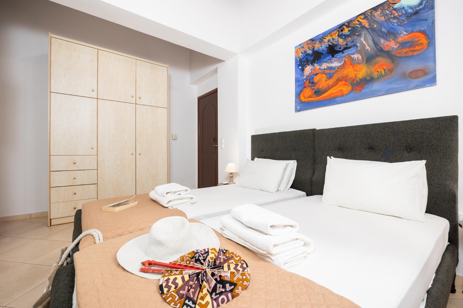 Twin bedroom with en suite bathroom and A/C