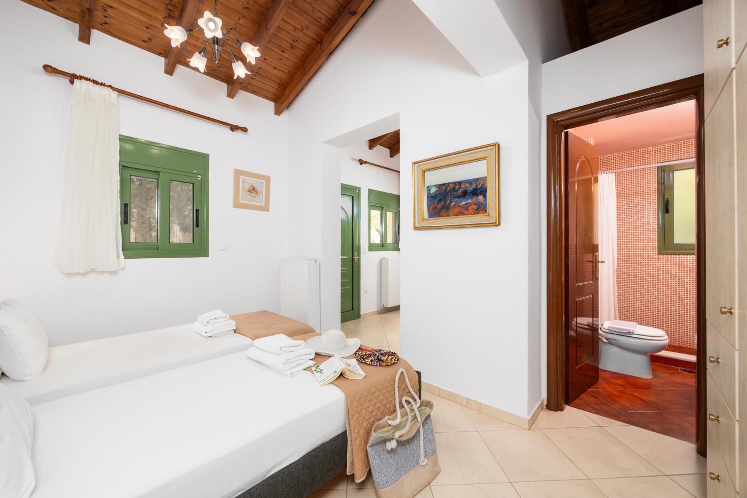 Twin bedroom with en suite bathroom and A/C