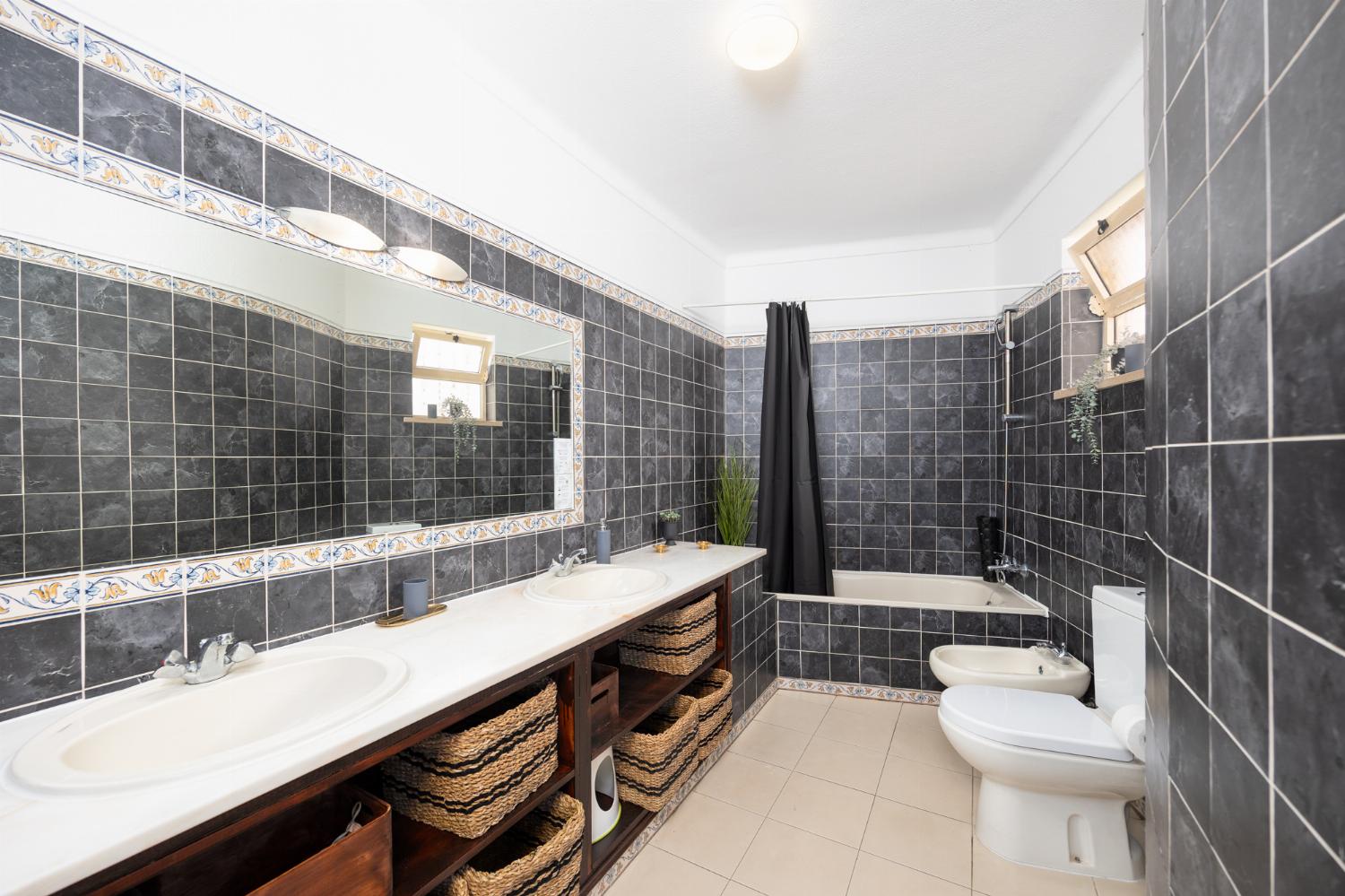 Family bathroom with bath and shower