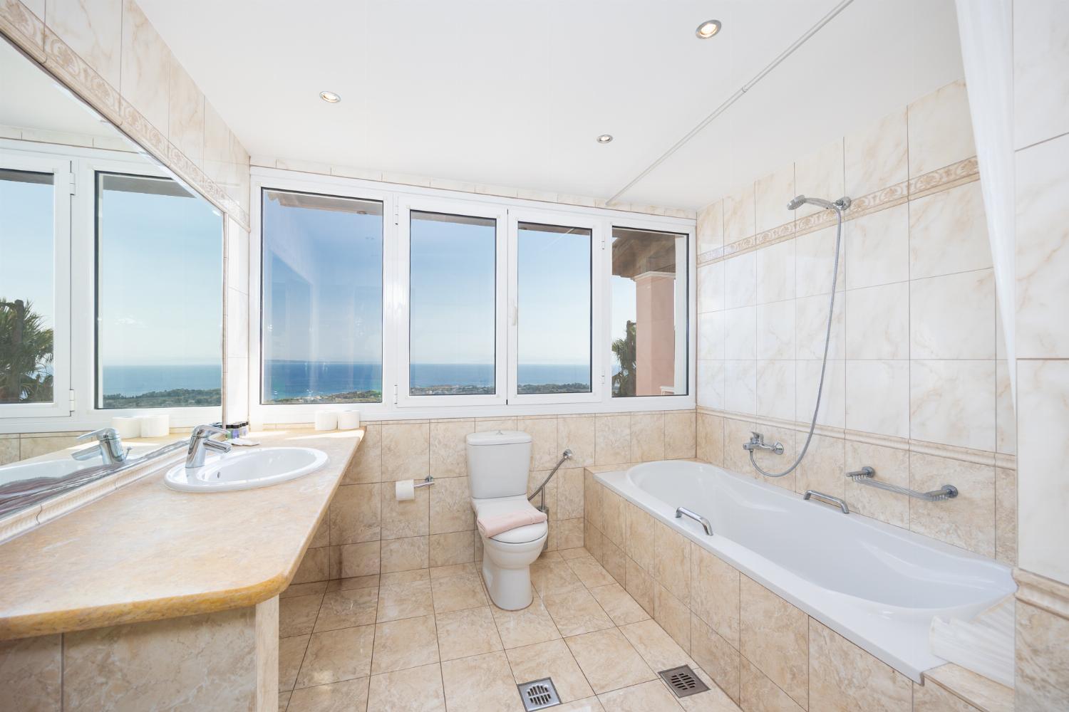 Family bathroom with bath and shower