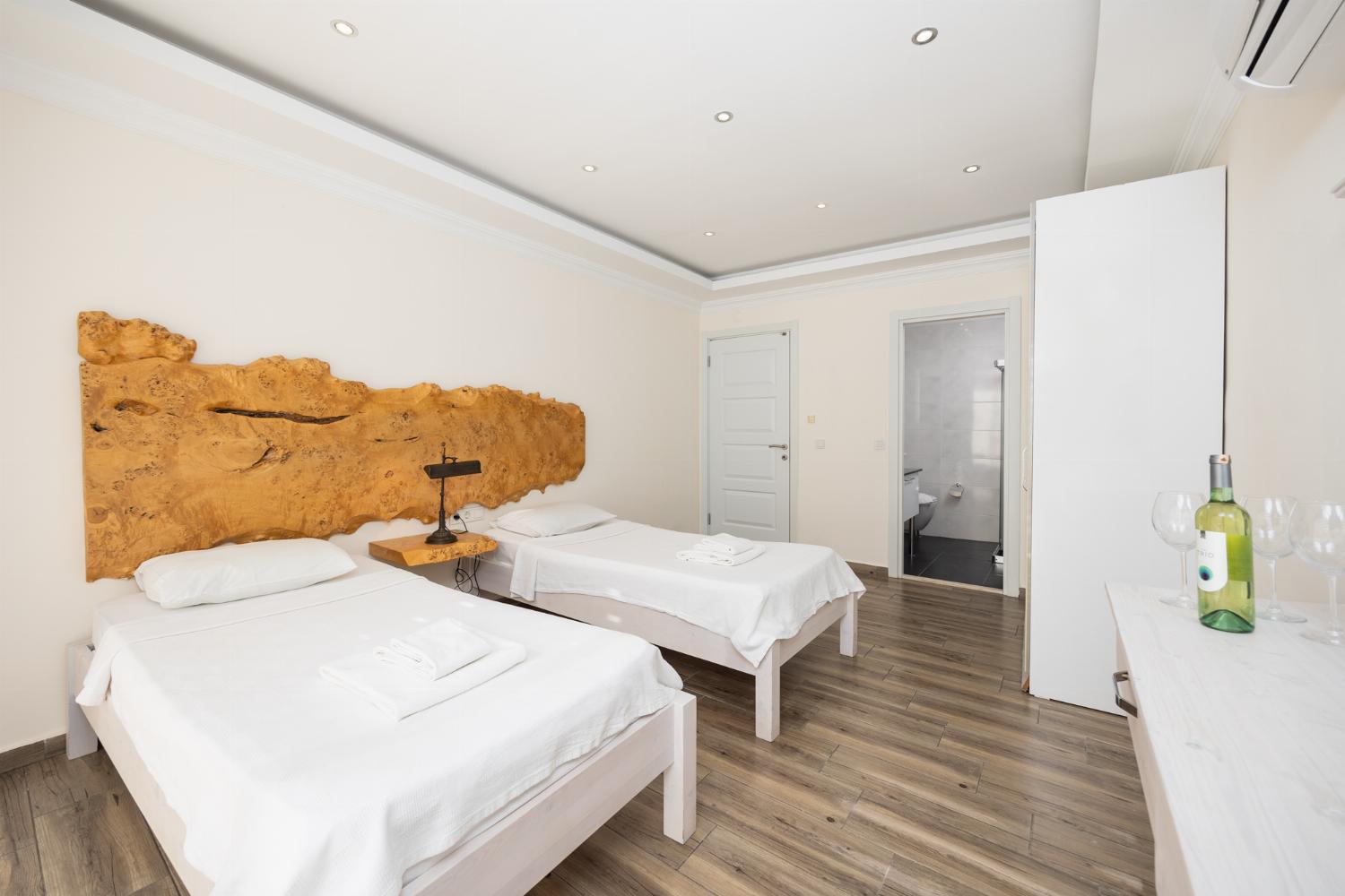 Twin bedroom with en suite bathroom and A/C