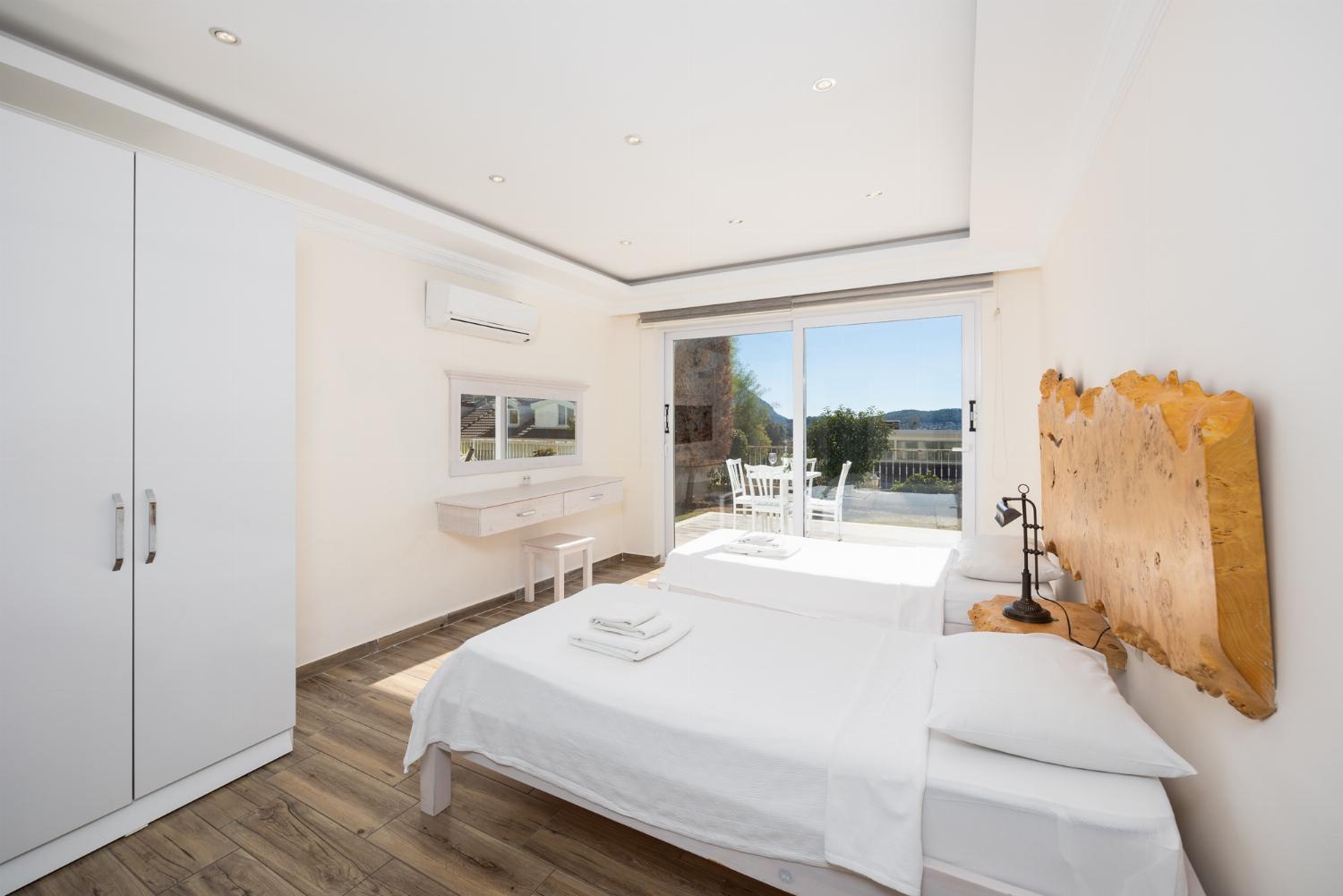 Twin bedroom with en suite bathroom and A/C